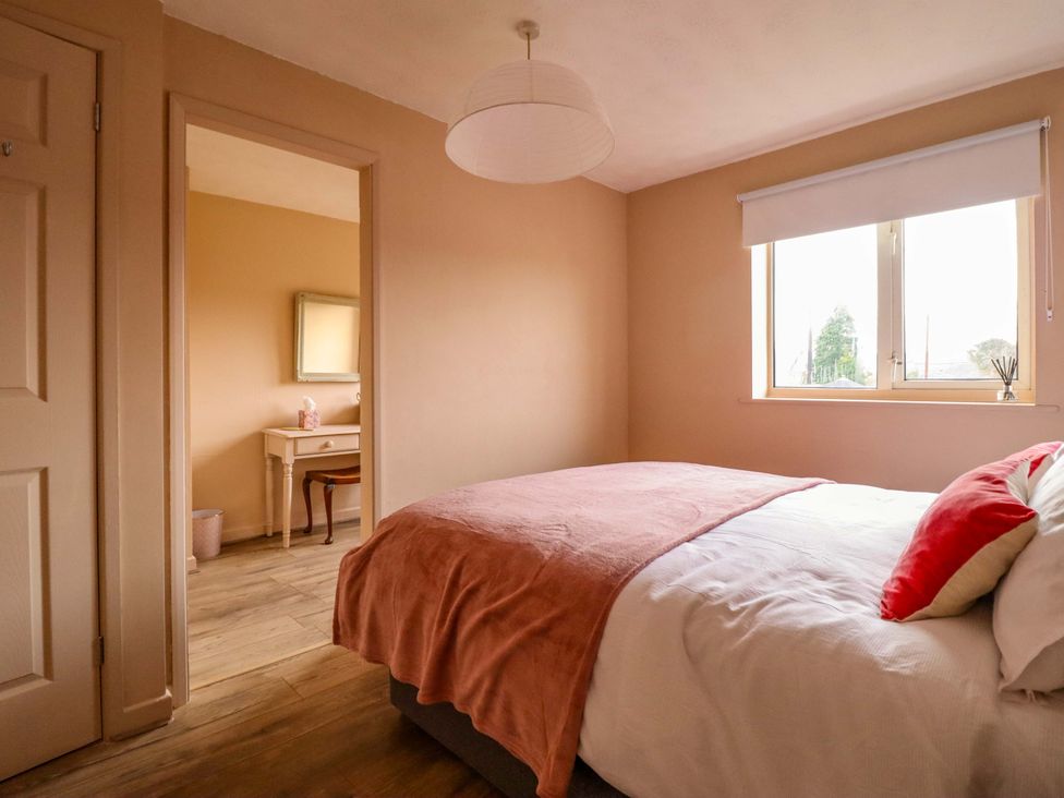 A bedroom with a bed and a desk at 2 Horseshoe Road Montgomery