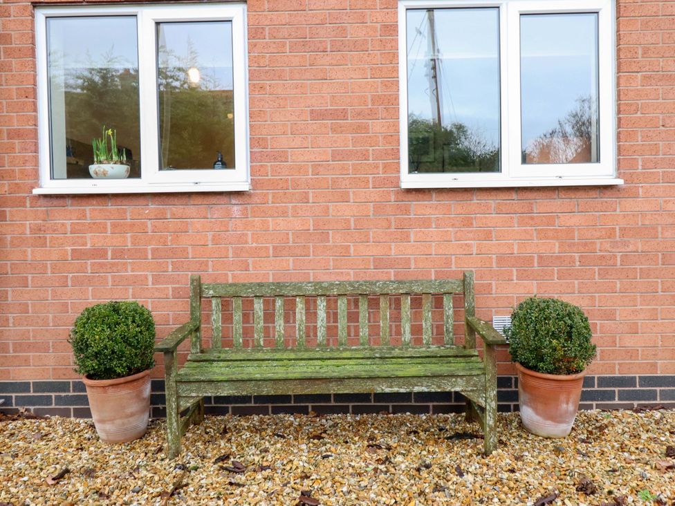 A bench in front of two windows at 2 Horseshoe Road, Montgomery