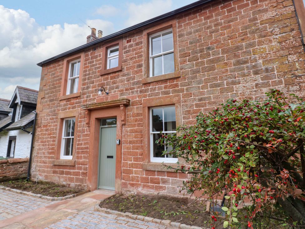 A house with a brick facade and a front door at Milford in Wetheral