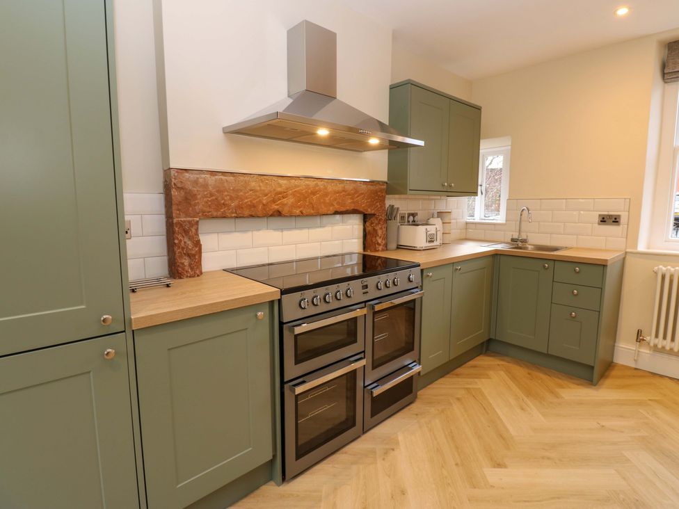 A kitchen with cabinets and an oven at Milford in Great Corby, Wetheral