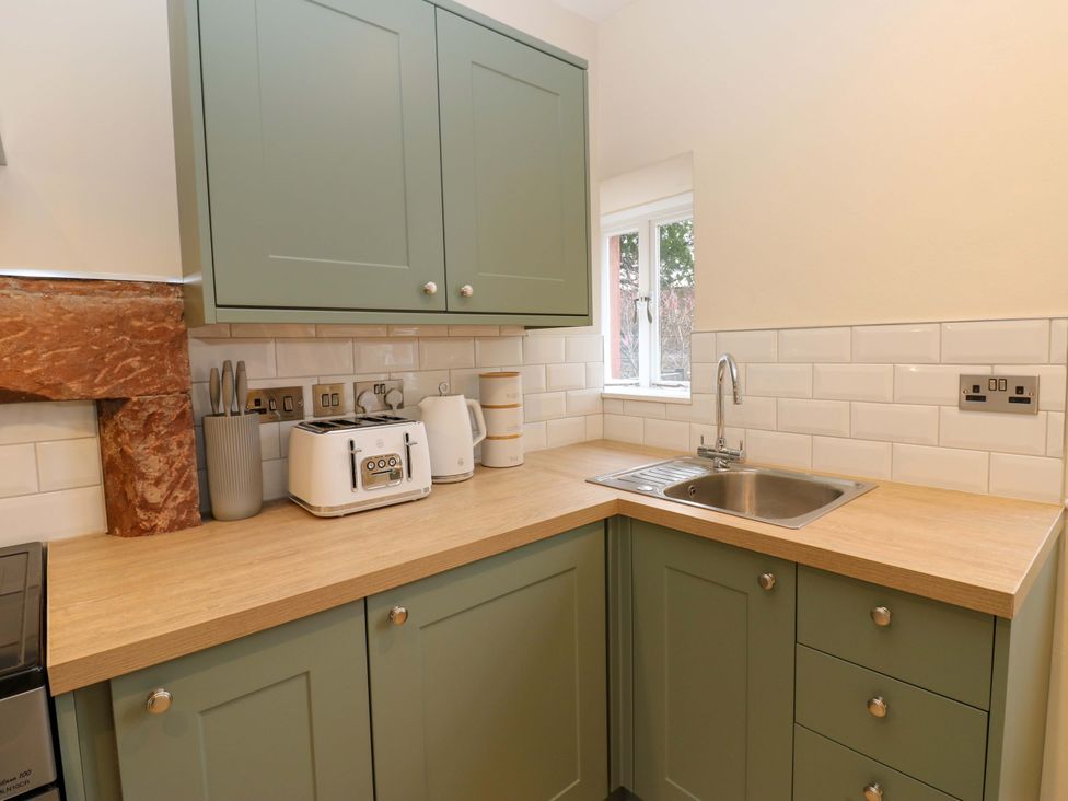 A kitchen with cabinets and appliances at Milford in Great Corby, Wetheral