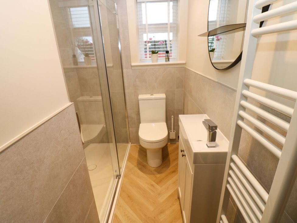 A bathroom with a shower and toilet at Milford in Great Corby, Wetheral