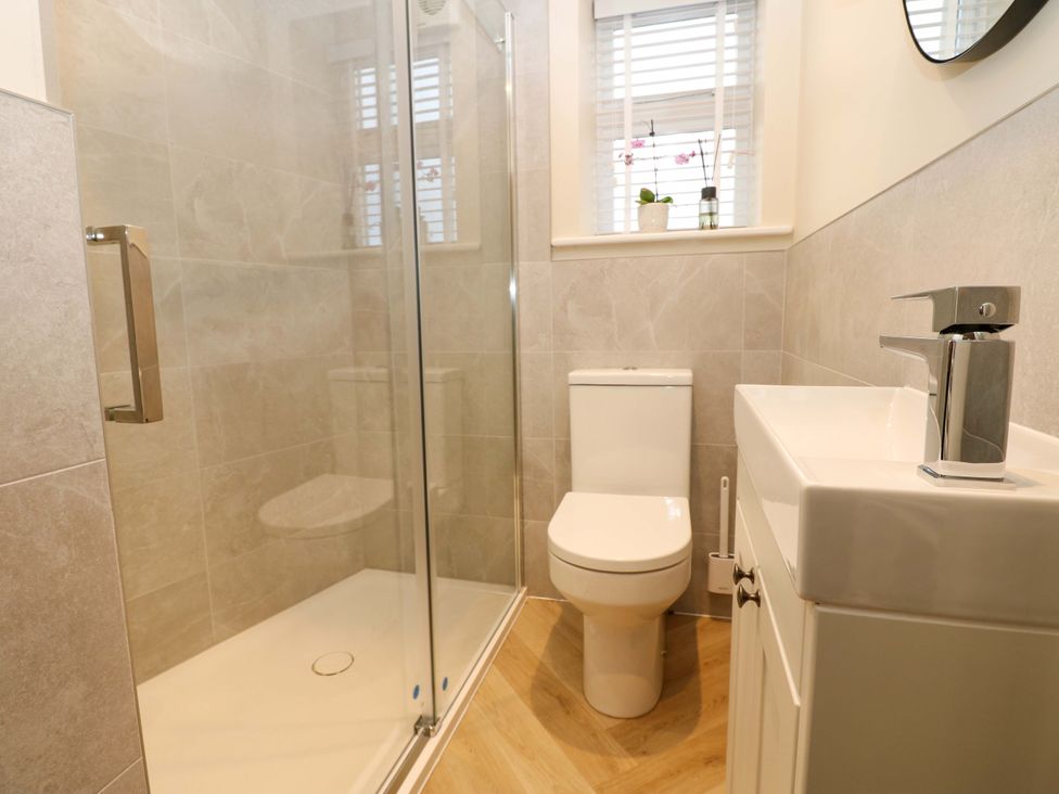A bathroom with a shower and toilet at Milford in Great Corby, Wetheral