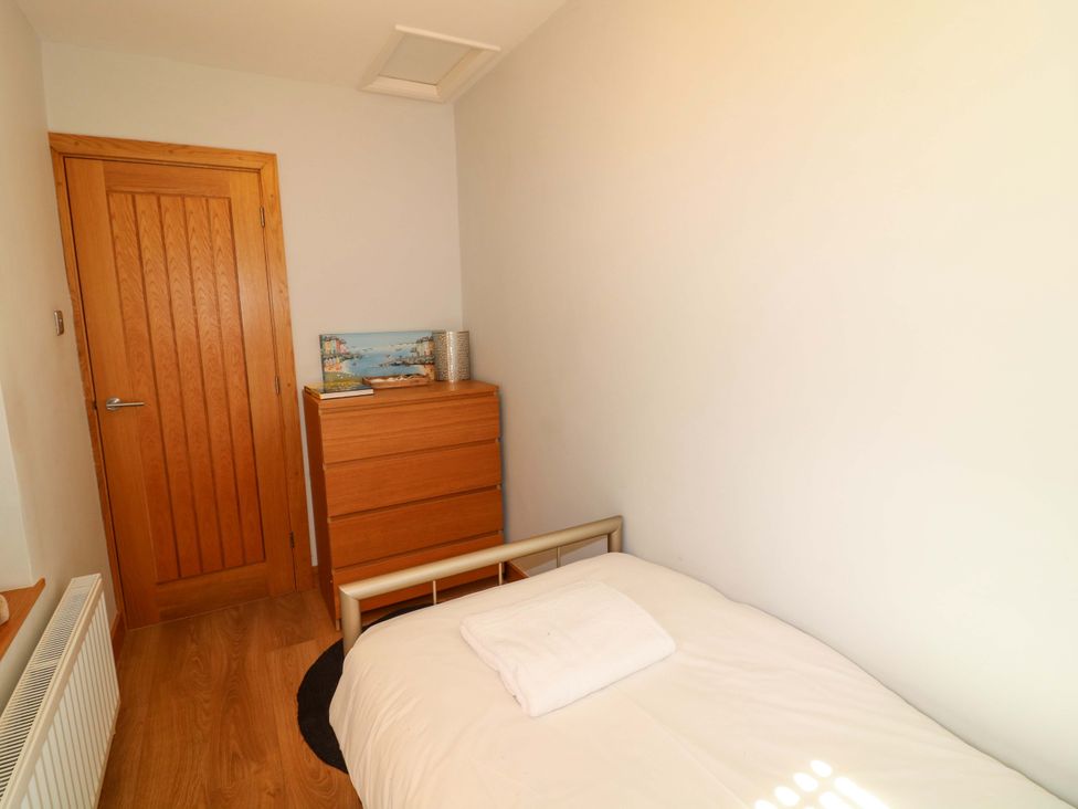 A bedroom with a bed and dresser at 6 Brook Court Thulston near Derby
