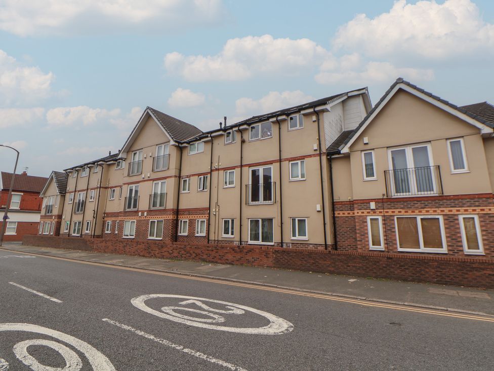 An apartment building with windows and balconies at Flat 12 in Wallasey