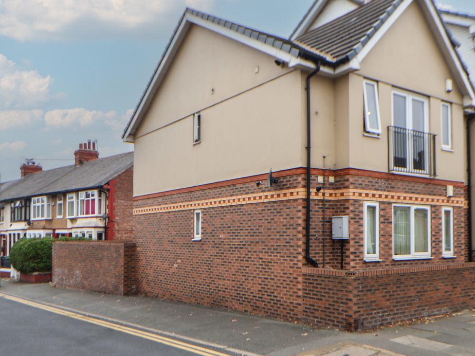 A building with windows and a balcony at Flat 12 in Wallasey