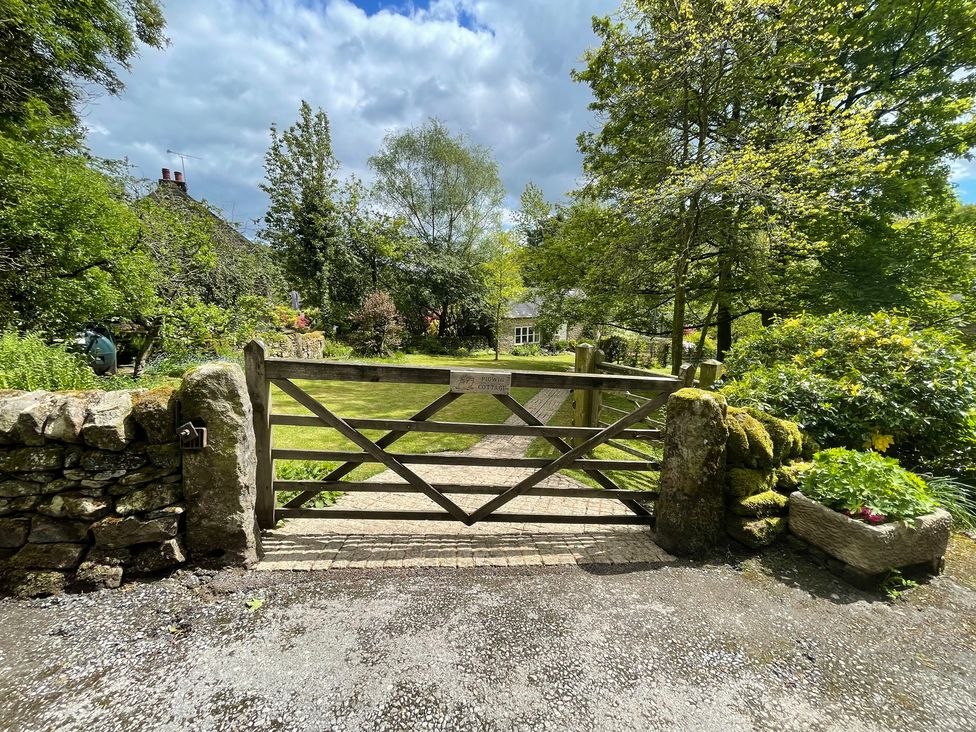 A wooden gate leading to a garden area at Pigwig Cottage near Longway Bank Crich