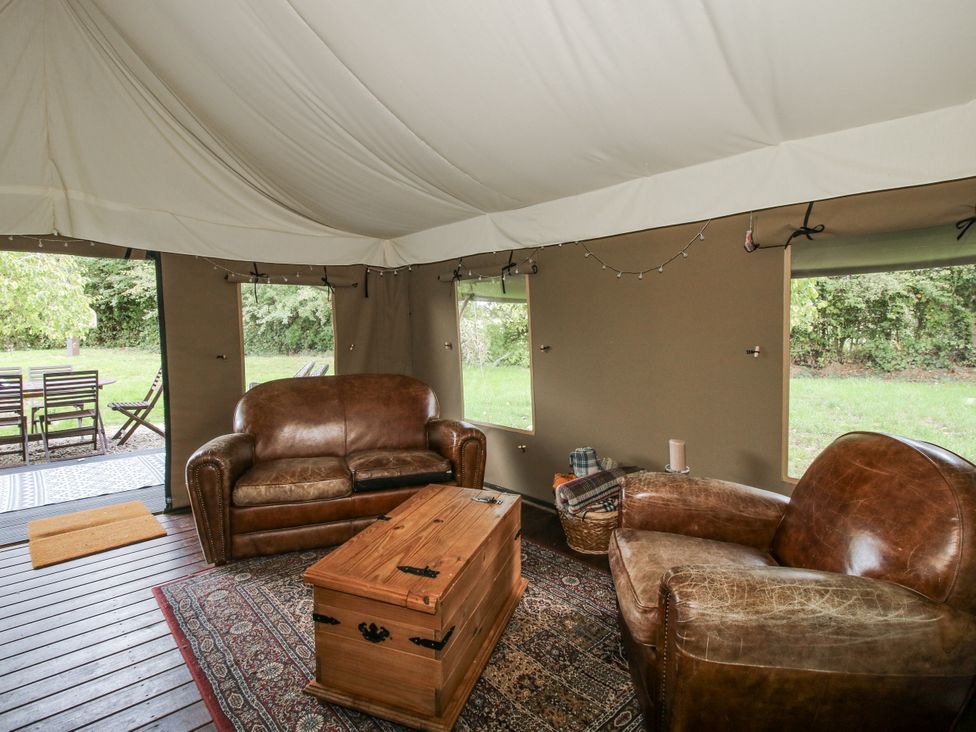A tent with seating and a coffee table at Hedgerow in Bewdley