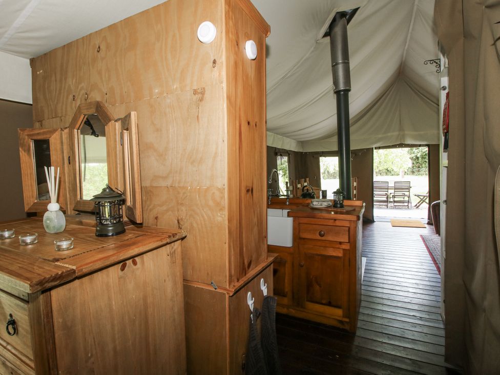 An indoor area with wooden furniture and a kitchen unit at Hedgerow in Bewdley