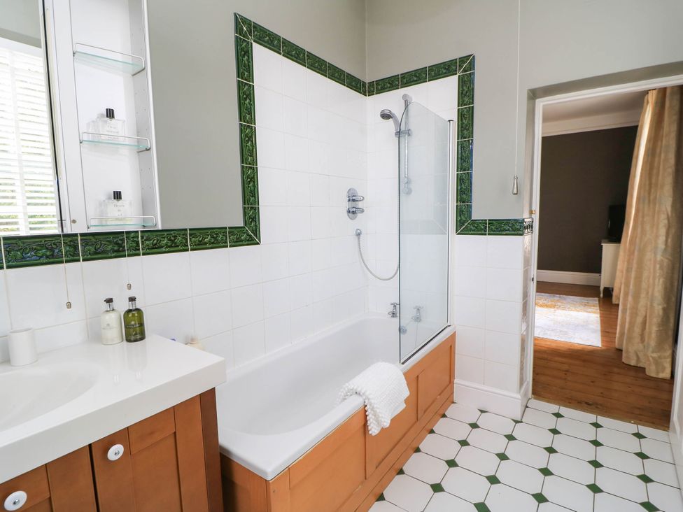 A bathroom with a bathtub and shower at The Mount in Chippenham