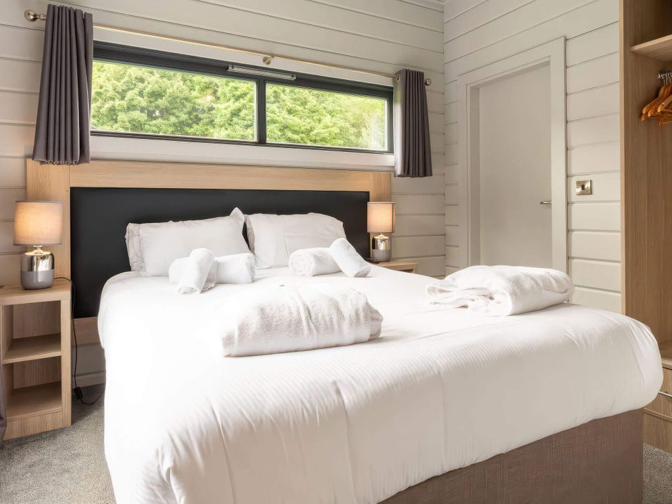 A bedroom with a bed and nightstand at Askrigg in Aysgarth