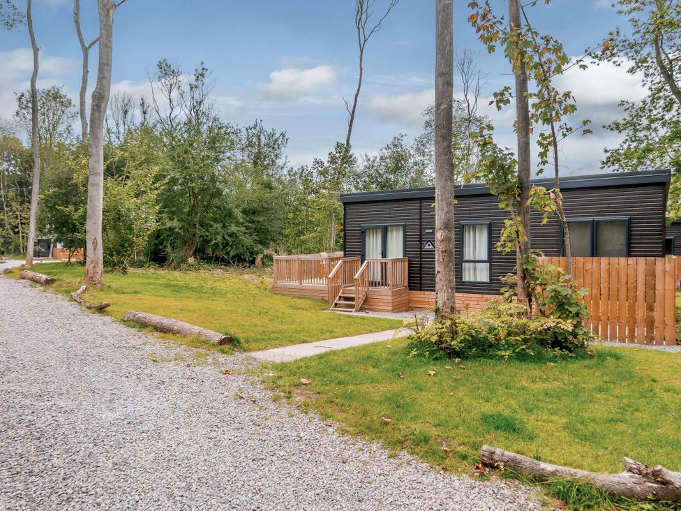 A house with a deck and pathway at Somersby (Pet) Louth