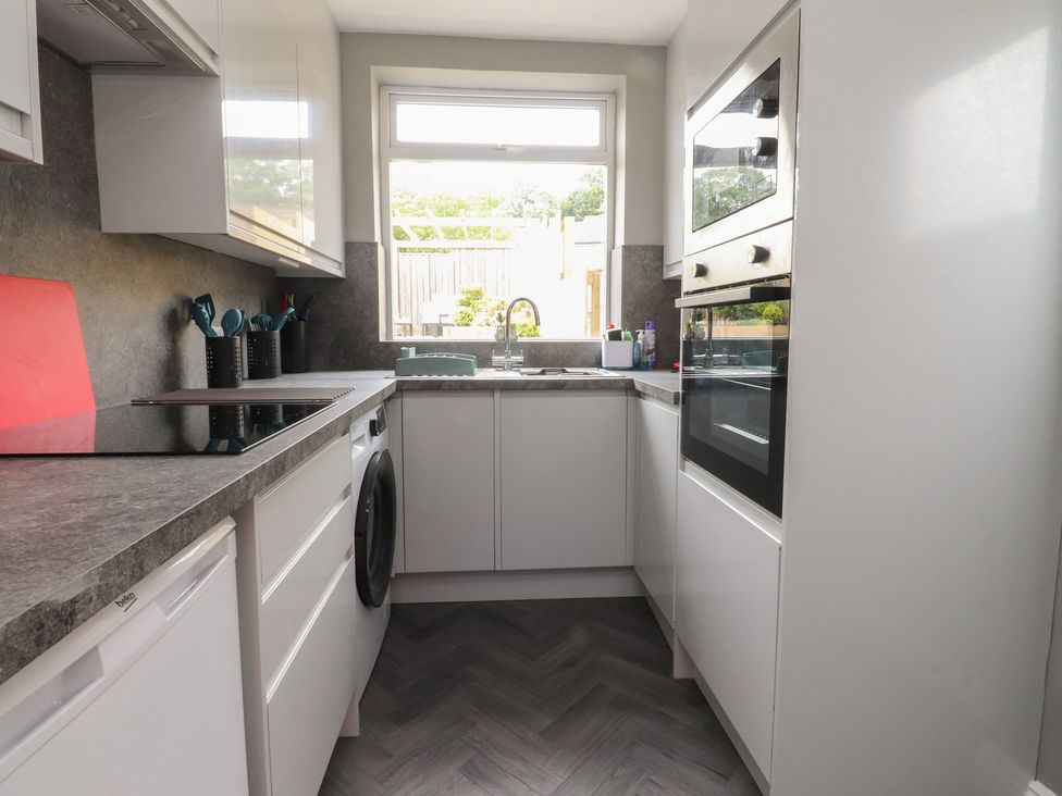 A kitchen with a sink and oven at 42 Windsor Avenue
