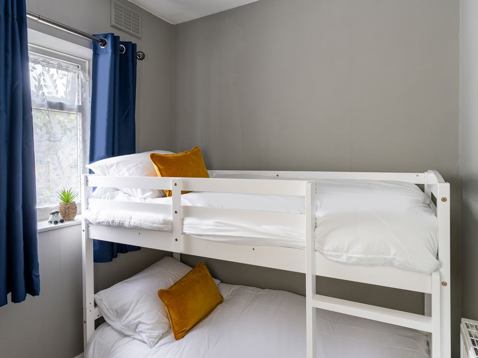 A bunk bed with pillows in a bedroom at Shepherd's Lodge in Skipton