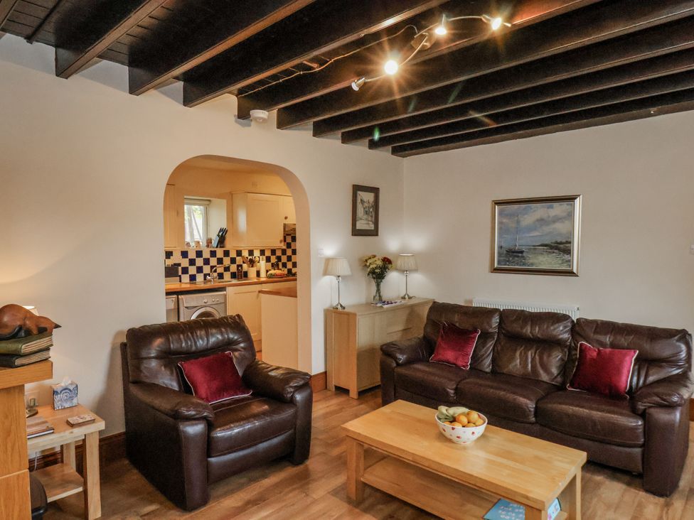 A living room with sofas and a coffee table at 2 High Stakesby Cottages in Whitby