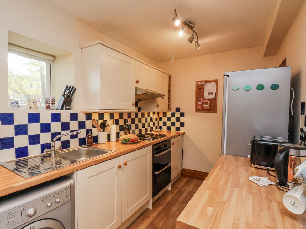 A kitchen with appliances and utensils at 2 High Stakesby Cottages Whitby