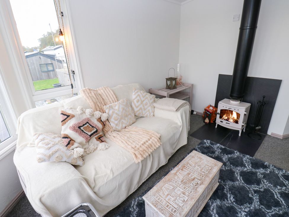 A living room with a couch and fireplace at John's Folly