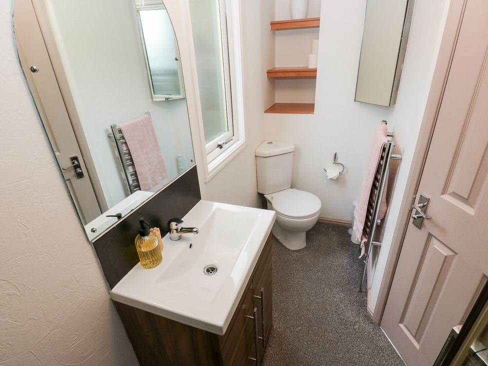 A bathroom with a sink and toilet at John's Folly