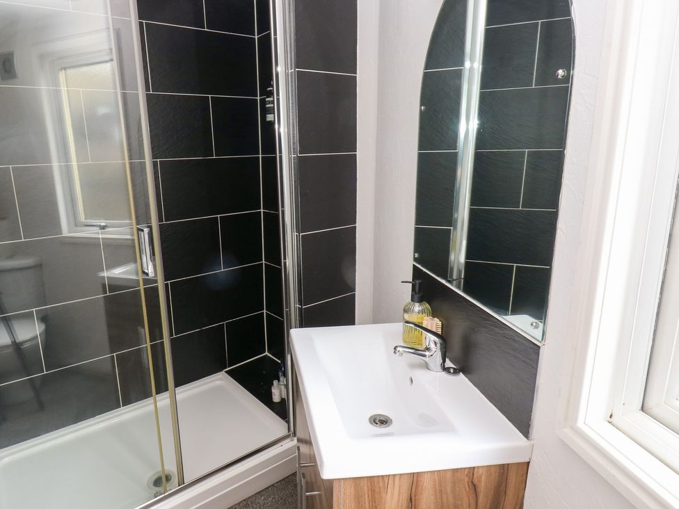 A bathroom featuring a shower and a sink at John's Folly