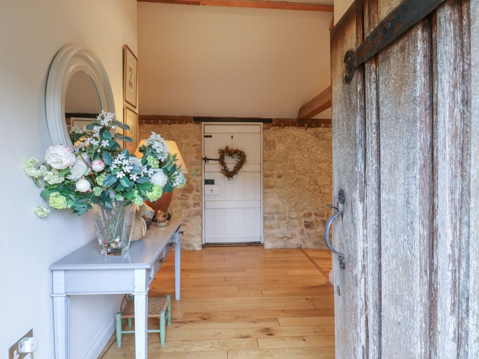 An entrance with flowers on a table at The Piggery in Maidstone