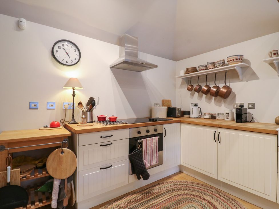 A kitchen with appliances and utensils at The Piggery Maidstone