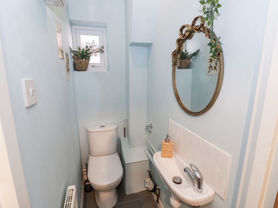 A bathroom with a toilet and sink at 3 Leycester Court Warwick