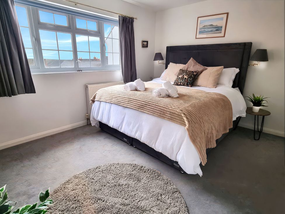 A bedroom with a bed and window at 3 Leycester Court in Warwick