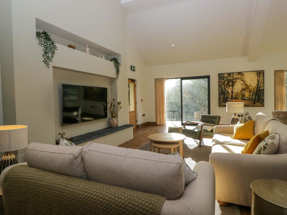 A living room with a sofa and television at The Old Bunkhouse in Grasmere