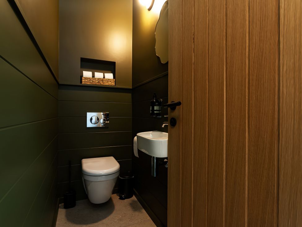 A bathroom with a toilet and sink at The Old Bunkhouse in Grasmere