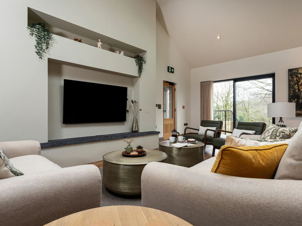 A living room with a television and coffee table at The Old Bunkhouse in Grasmere