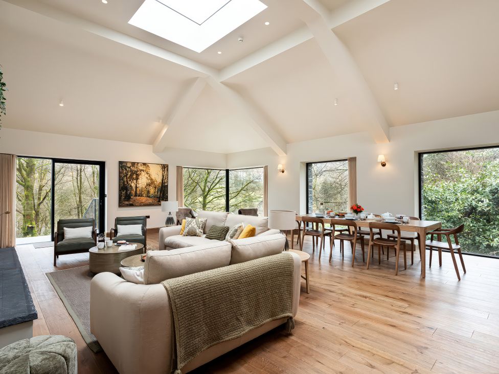 A living room with a sofa and dining table at The Old Bunkhouse in Grasmere