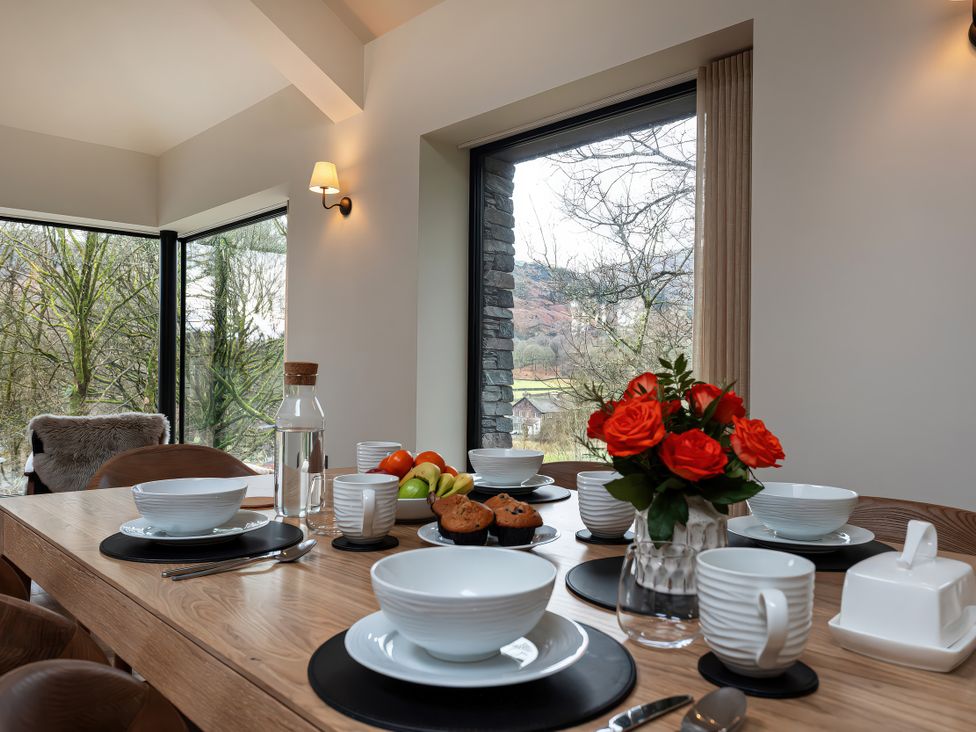 A dining room with a table set for a meal at The Old Bunkhouse in Grasmere