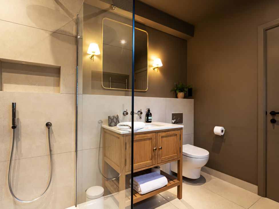 A bathroom with a sink and shower at The Old Bunkhouse in Grasmere