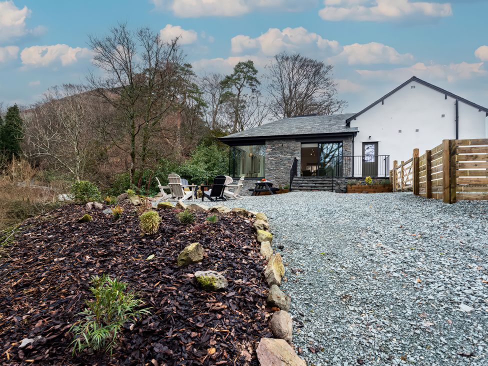 An outdoor area with gravel and seating at The Old Bunkhouse in Grasmere