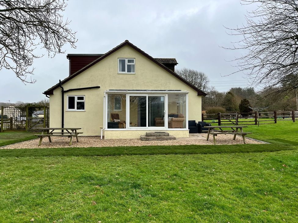 A house with patio and furniture at Court House Farmhouse in Charmouth