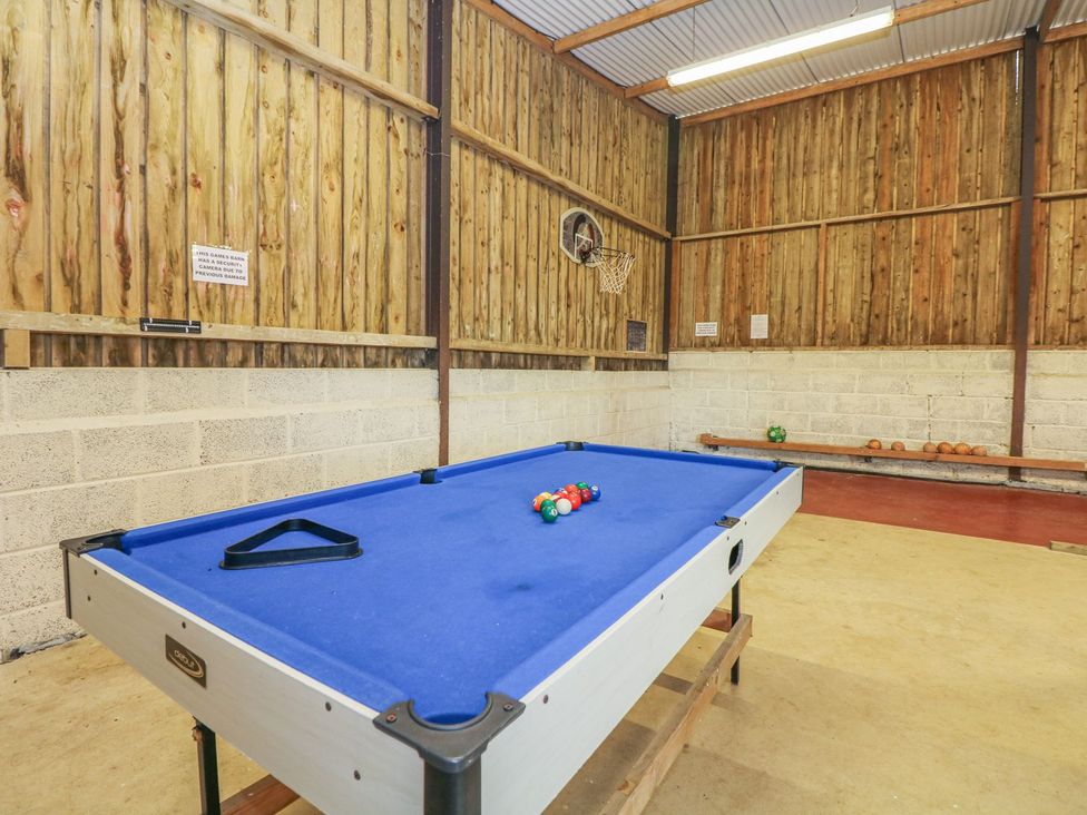 A game room featuring a pool table and basketball hoop at Court House Farmhouse in Charmouth
