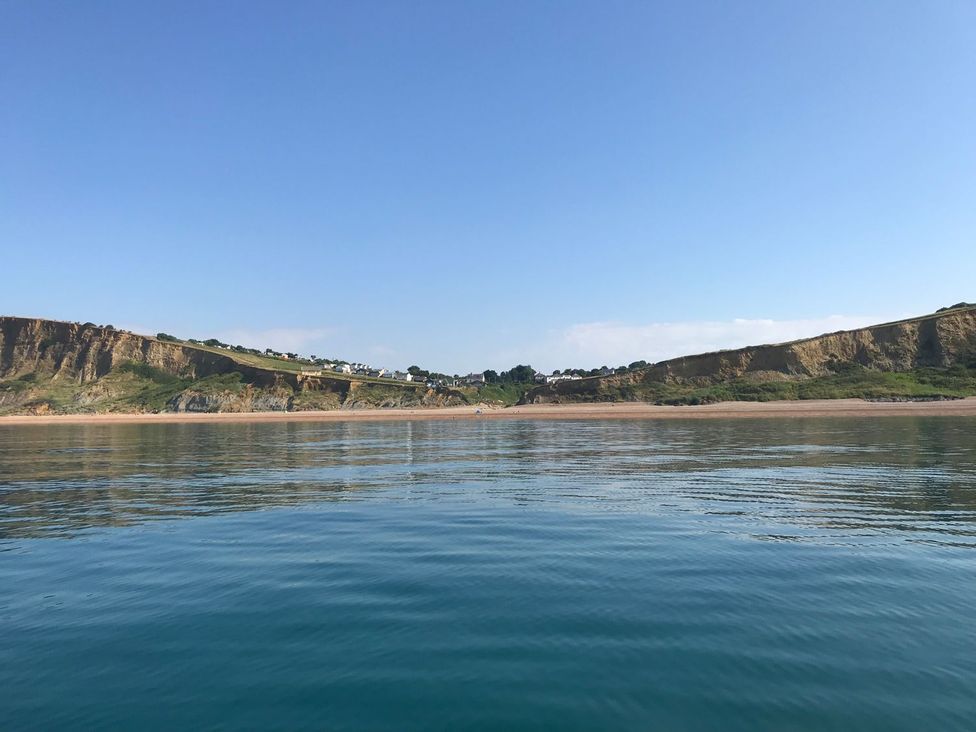 A view of cliffs and water at Court House Farmhouse in Charmouth