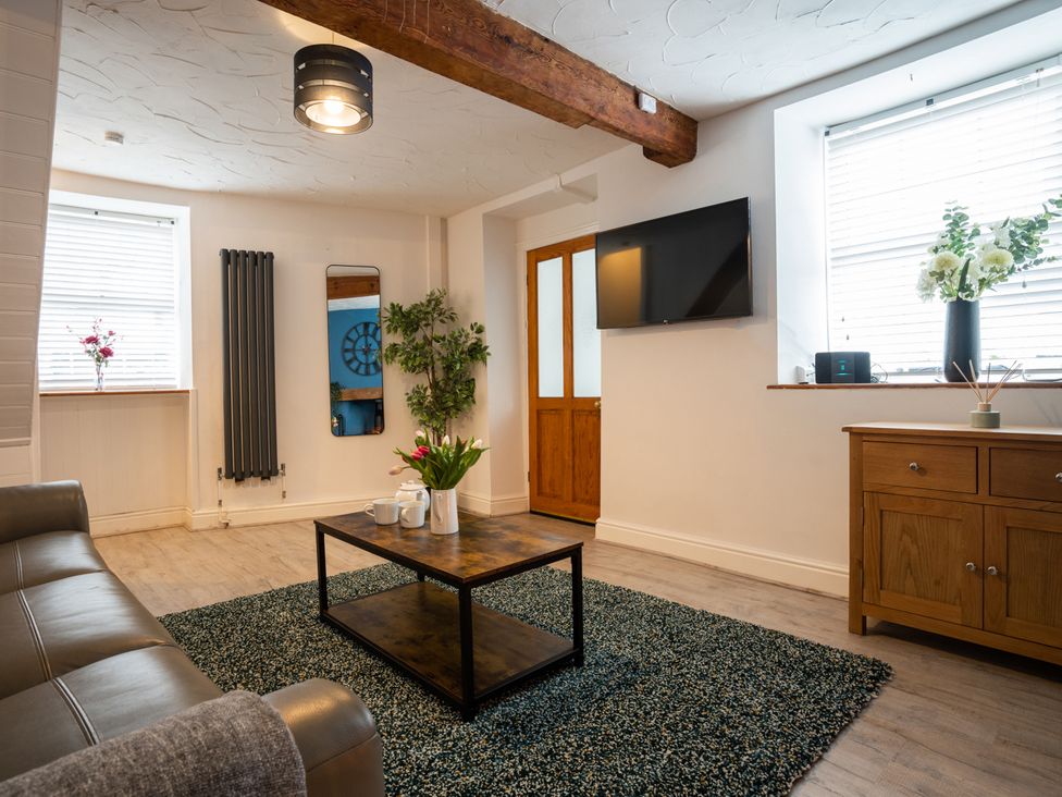 A living room with a coffee table and sofa at Garn View in Dolgellau