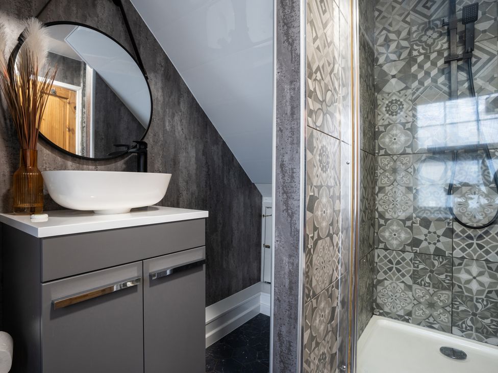 A bathroom with a sink and shower at Garn View in Dolgellau