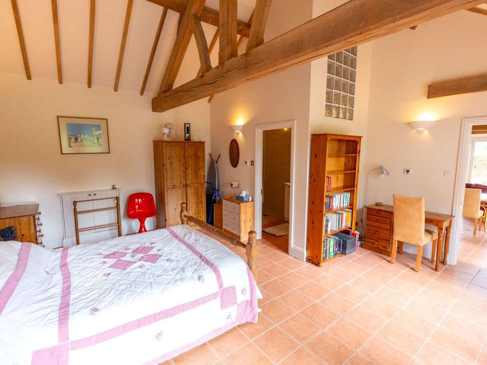 A bedroom with a bed and furniture at Nature's Lodge in Kidderminster