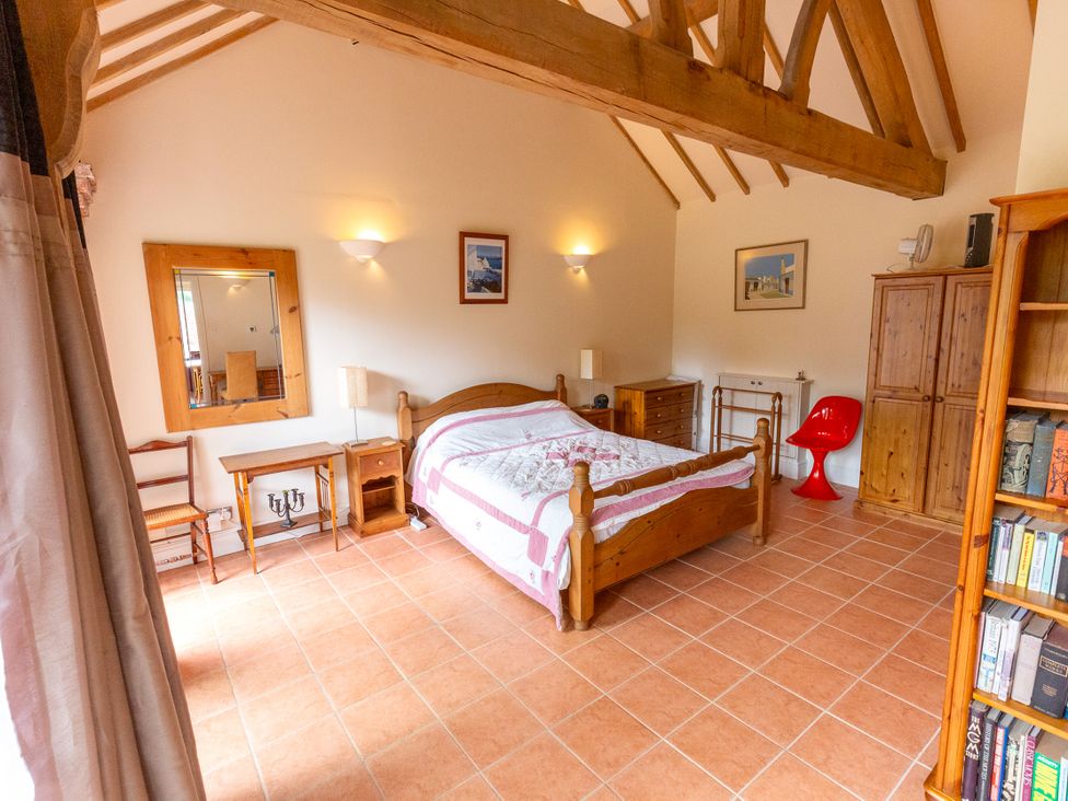 A bedroom with a bed and furniture at Nature's Lodge in Kidderminster