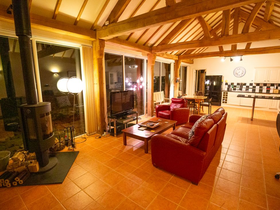 A living room with a sofa and coffee table at Nature's Lodge in Kidderminster