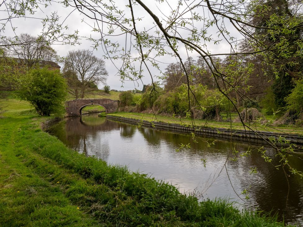 A canal with water and a bridge in Cookley