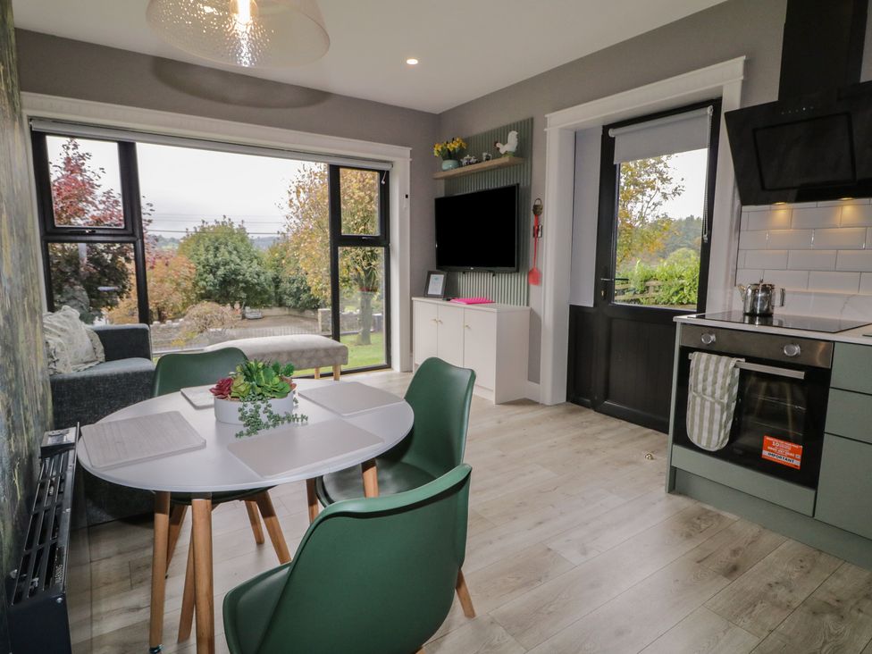 A kitchen with a table and chairs at Lake view House Apartment 