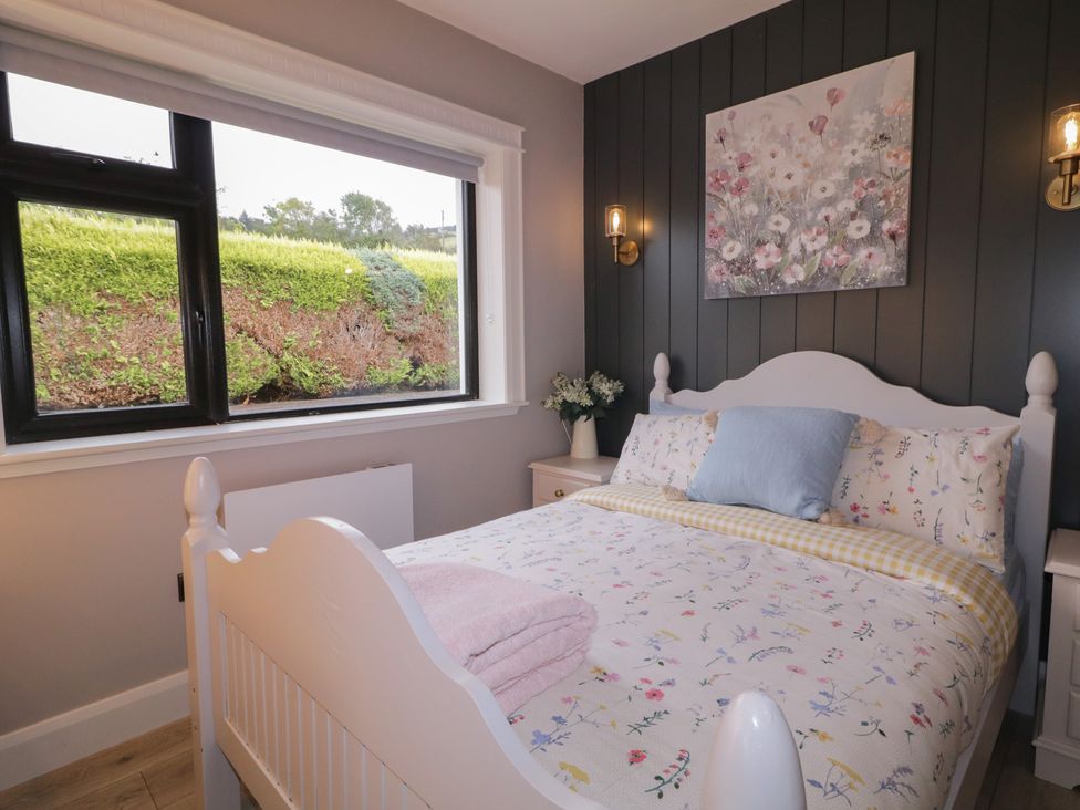 A bedroom with a bed and a window at Lake view House Apartment 