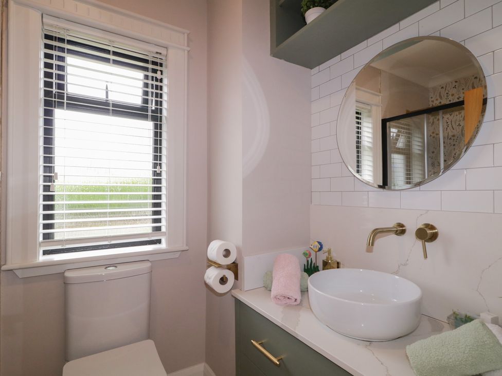 A bathroom with a sink and toilet at Lake view House Apartment