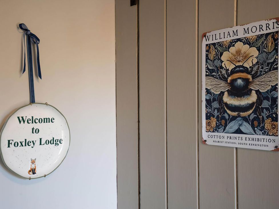 A welcome sign and art print at Foxley Lodge, Norwich