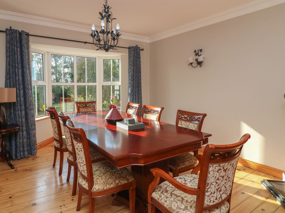 A dining room with a table and chairs at The Lodge Bolinahaney Bunclody, County Wexford