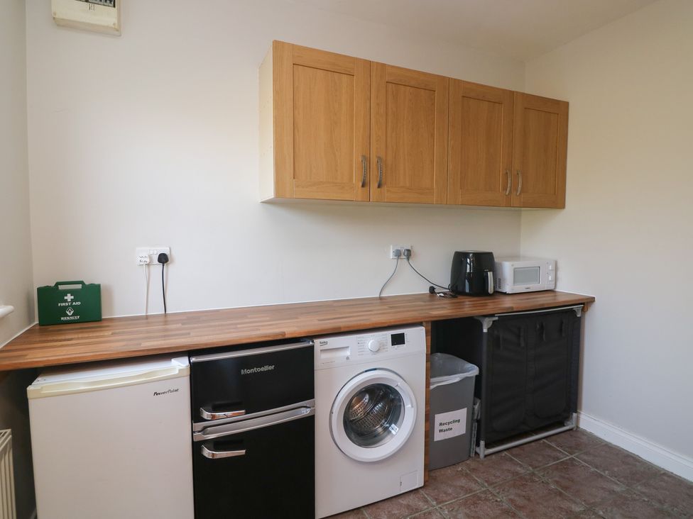 A kitchen with appliances and cabinets at The Lodge Bolinahaney in Bunclody, County Wexford