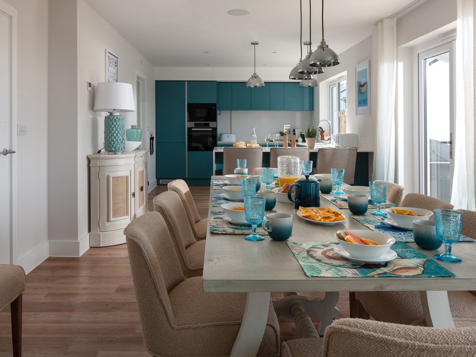 A dining room with a table set for breakfast at Polview in Newquay